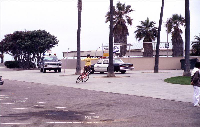 Bicyclist standing on seat